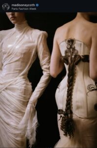 Instagram screenshot of two runway looks taken backstage