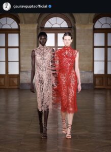 Instagram screenshot of the show's look featuring web-like thread techniques merging two pieces and bodies into one