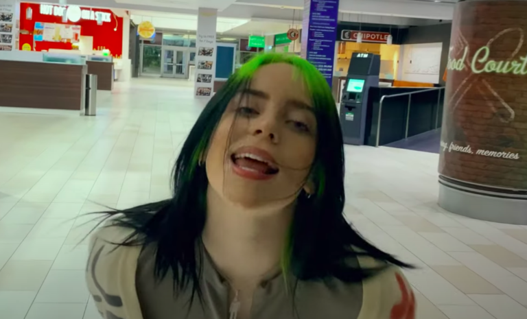 Watch Billie Eilish Run Around a Deserted Mall in the Self-Directed Video for New Song ‘Therefore I Am’