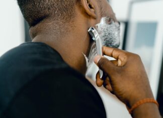 man shaving himself