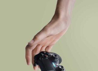 person holding Sony DualShock 4 wireless controller