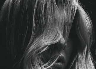 grayscale photo of womans face