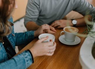 two mugs with coffee on table