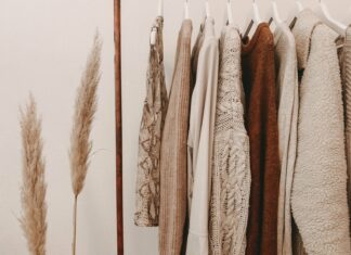 hanged top on brown and white clothes horse