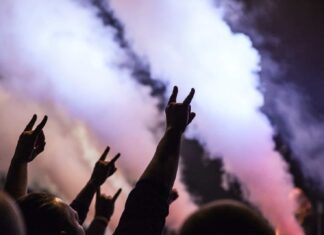 photo of persons doing rock hand sign