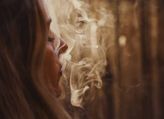 woman with blonde hair looking at the light