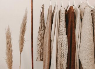 hanged top on brown and white clothes horse