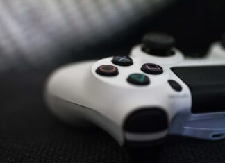 closeup of white Sony PS4 controller