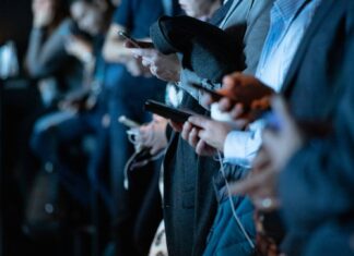 people using phone while standing