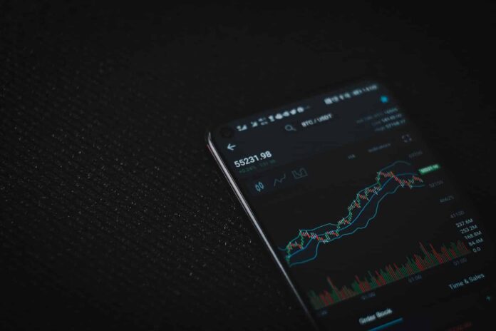 black android smartphone on black textile