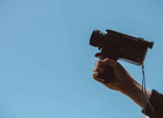 person holding video camera