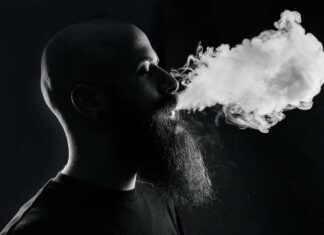 man smoking with black background