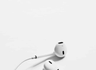 apple earpods on white surface
