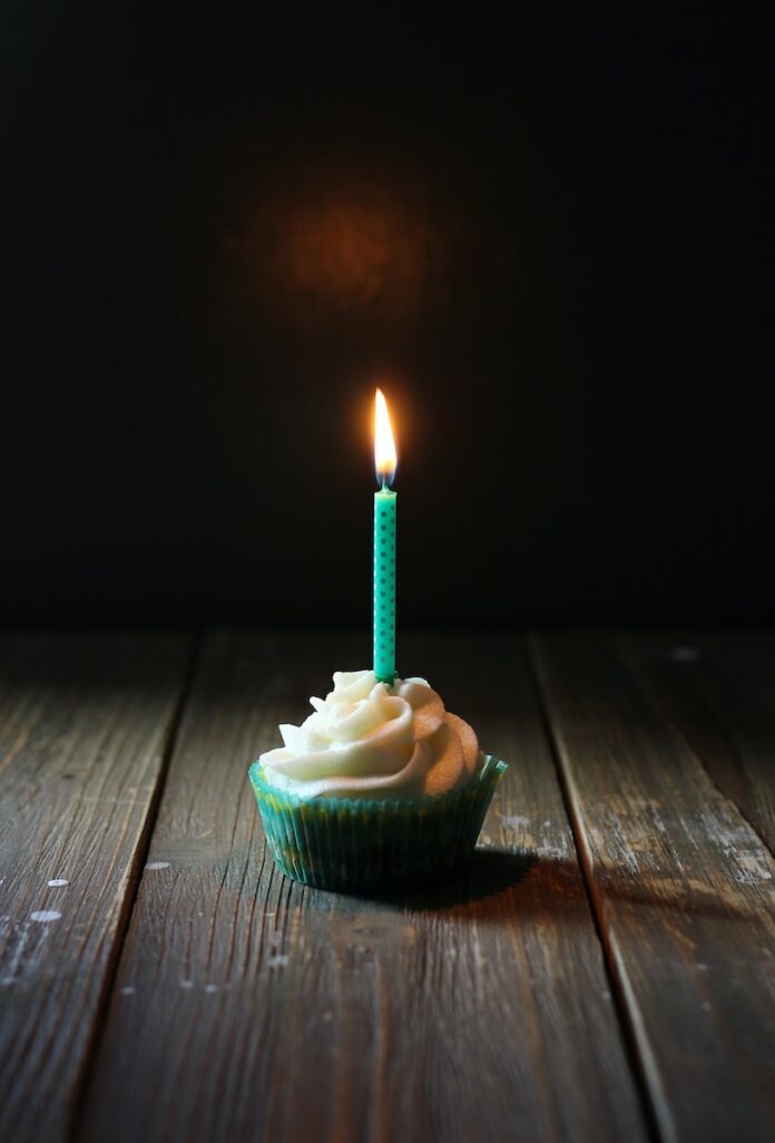 taper candle on cupcake