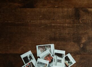 white and brown picture frame on brown wooden table