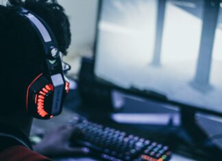 person wearing orange and black headphones