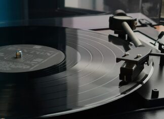 a turntable with a record player on top of it