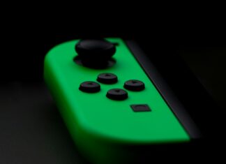 close-up photography of Nintendo Switch neon green controller