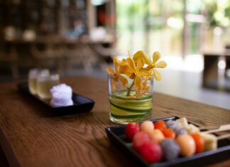 a wooden table topped with a plate of food