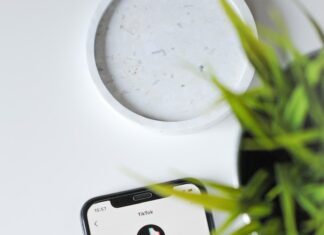 iphone xs on white table