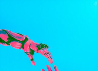 two hands reaching for a flying object in the sky