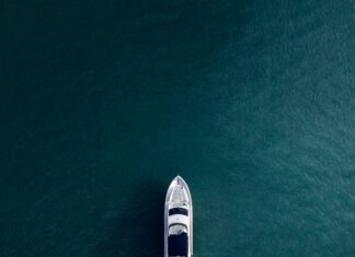 aerial photography of white yacht on calm waters