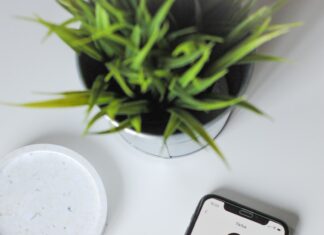 iphone xs on white table