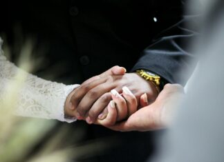 man and woman holding hands