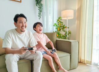 a person and a child sitting on a couch