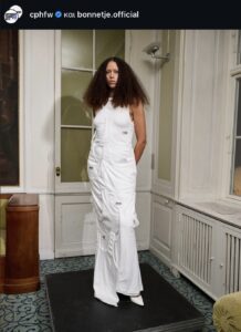 Instagram screenshot of a runway moment at Bonnetje's show featuring a dress made out of tank tops.